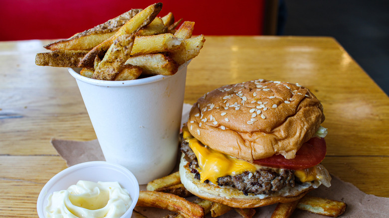 Five Guys burger and cup of french fries