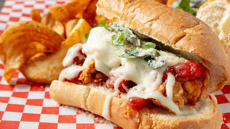 A closeup view of a chicken Parmesan sandwich.