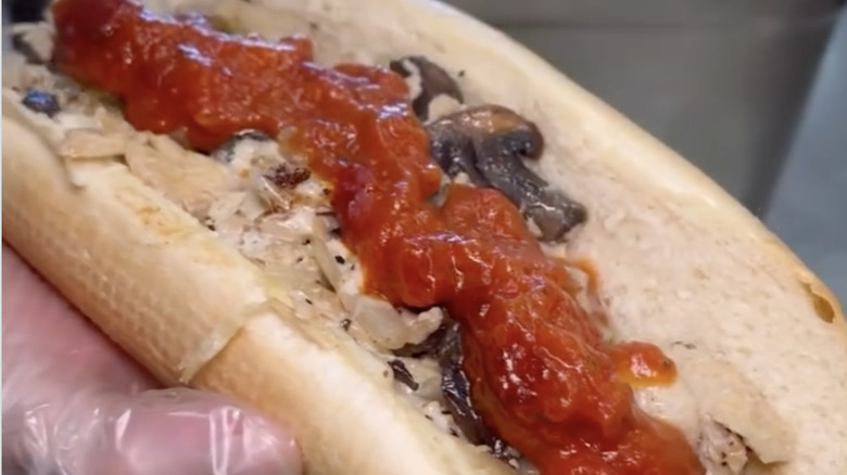 The grilled Parmesan chicken sub being made at Capriotti's with onion, marinara, and mushrooms
