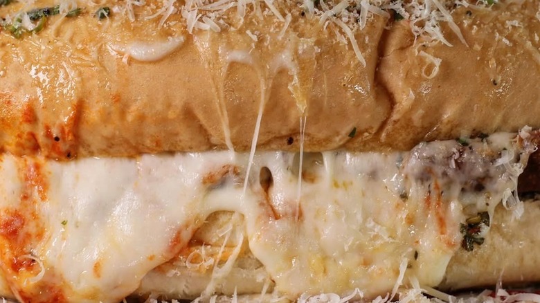 An up close shot of the chicken Parmesan sandwich with melted cheese from Little Hats Market
