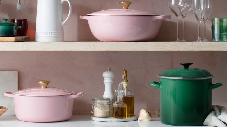 Pink and green Le Creuset pots and pans