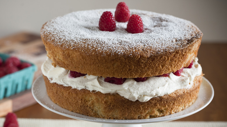 Two layer cake with berries and cream