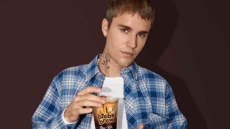 Justin Bieber holding Biebs Brew coffee