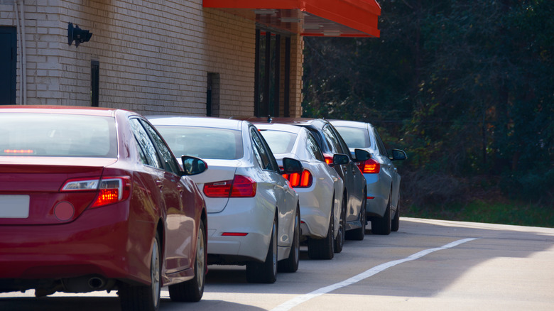 cars lined up at drive-thru