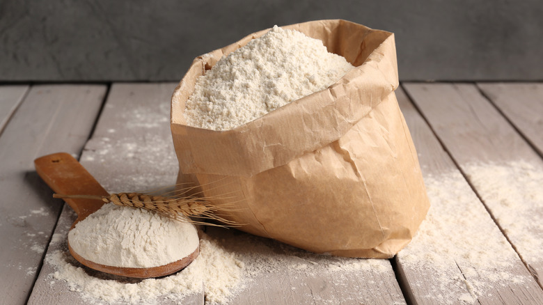 Sagging open paper bag of flour