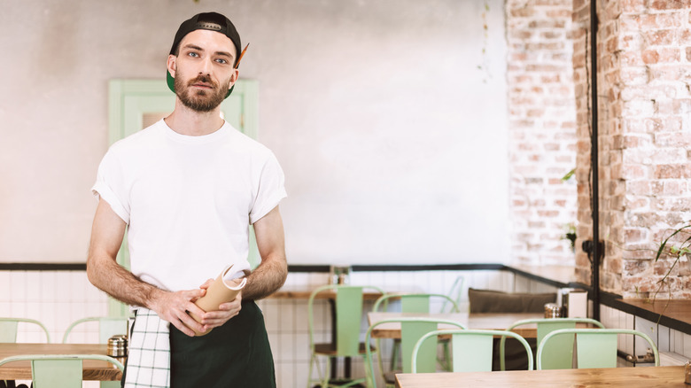 unfriendly-looking hipster server