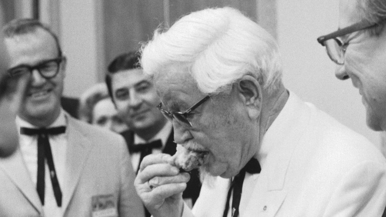 Colonel Sanders eating chicken