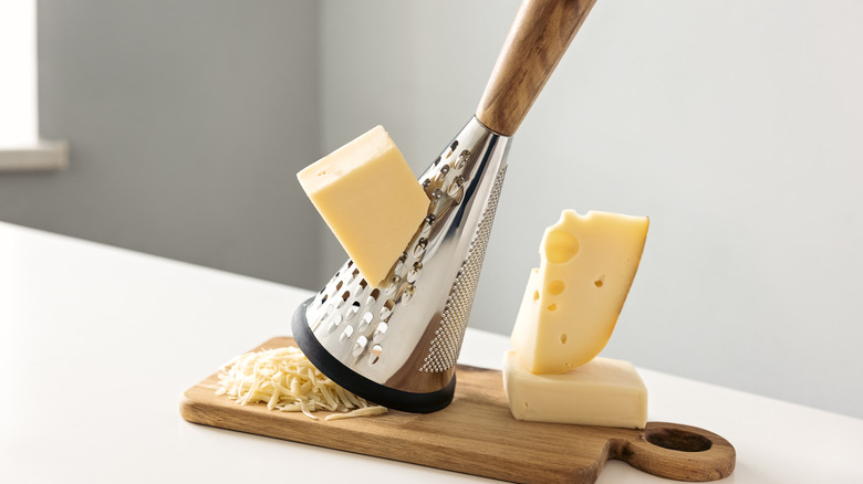 Cheese and grater on board