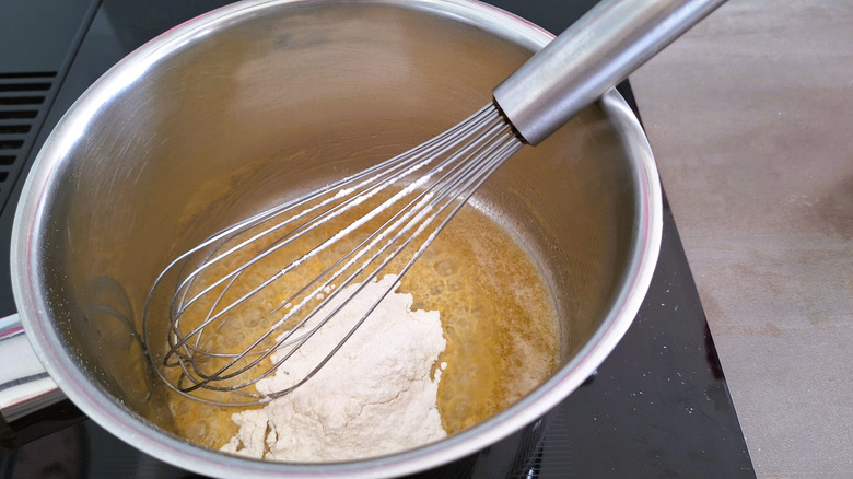 Mixing a roux in saucepan