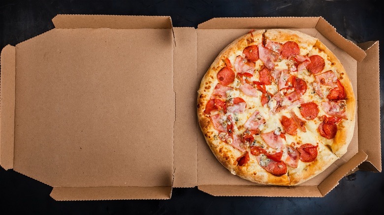 Open box with pizza