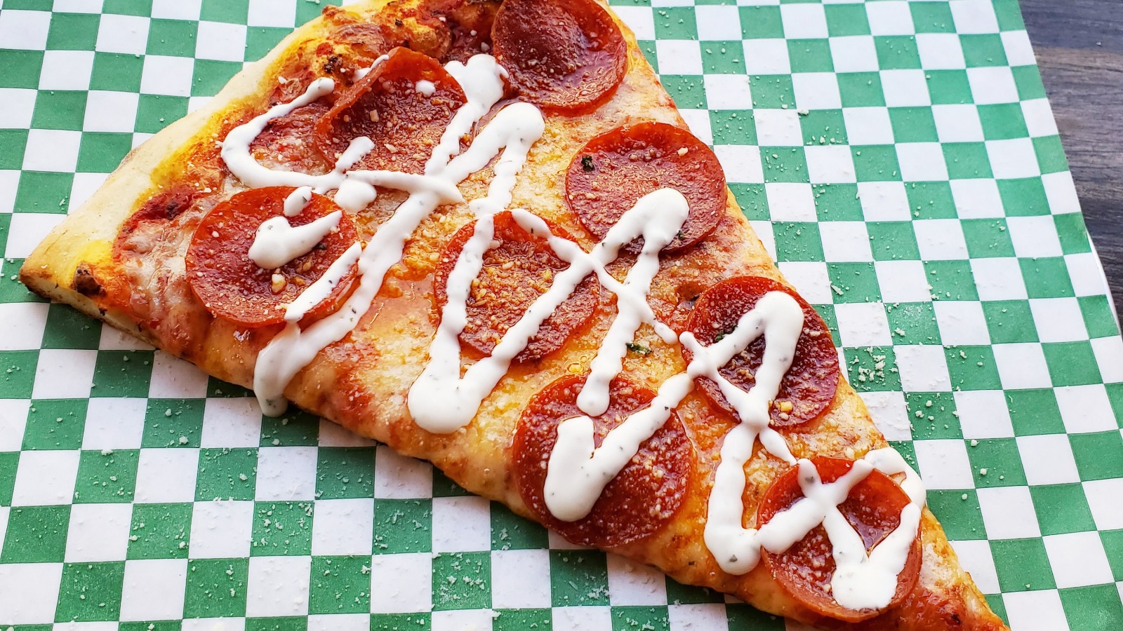 Here's Why So Many People Eat Pizza With Ranch