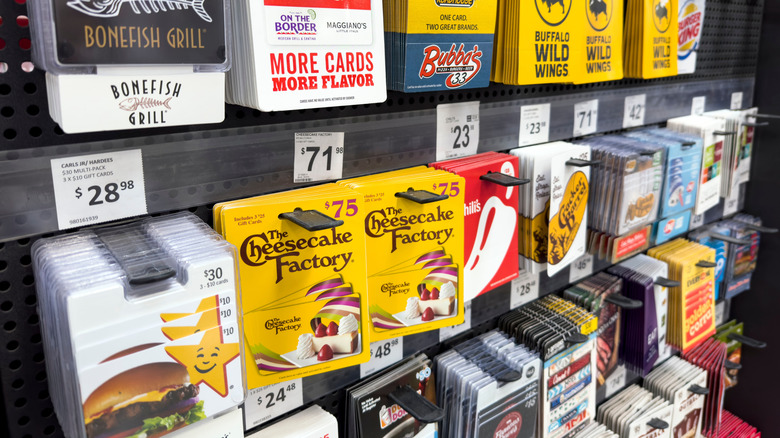 Racks of assorted gift cards in store.