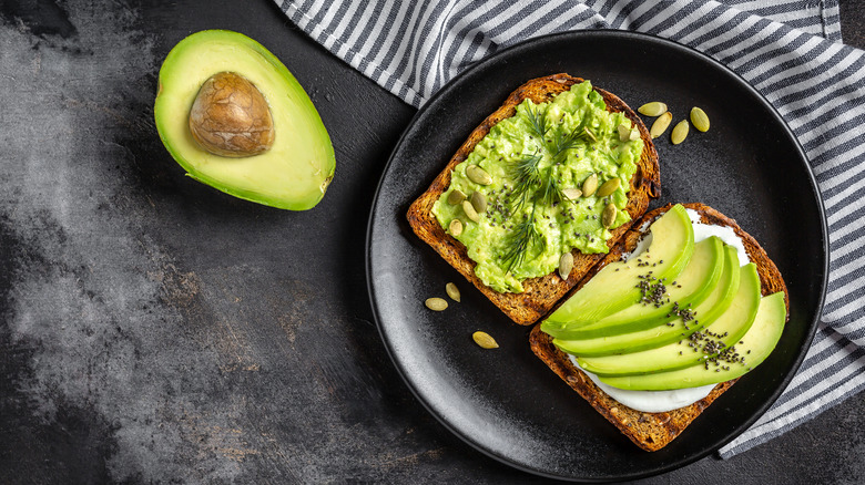 Avocado toast with half an avocado
