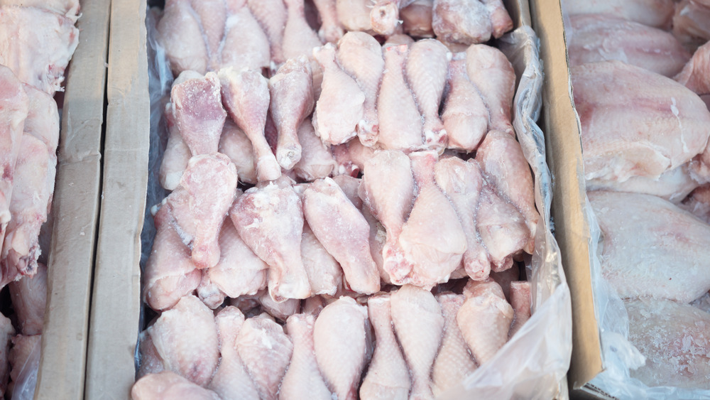 frozen chicken legs on display