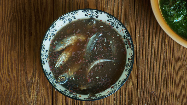 A bowl of fish fermenting into sauce