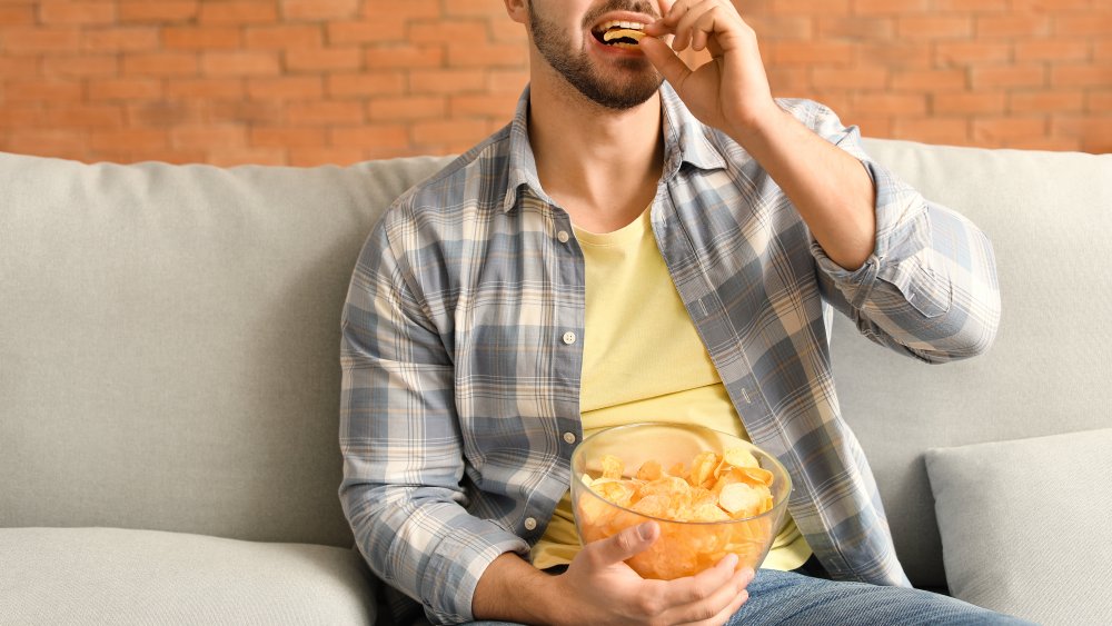 Person eating chips