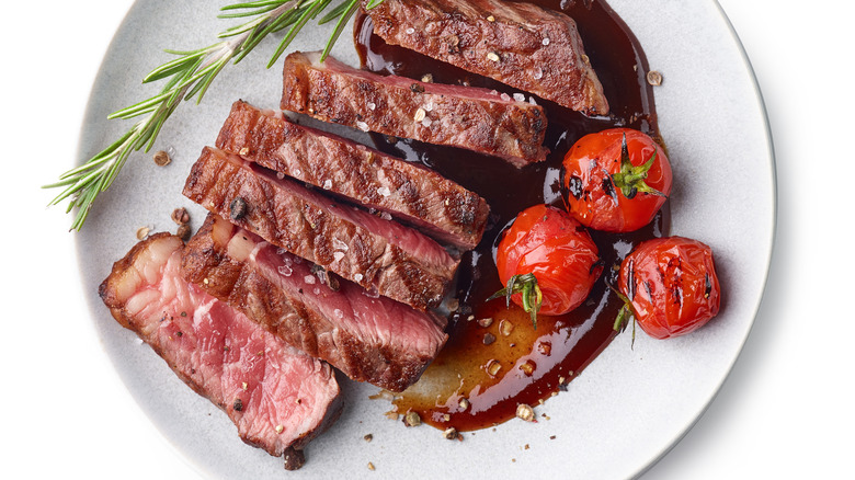 Grilled steak with tomatoes