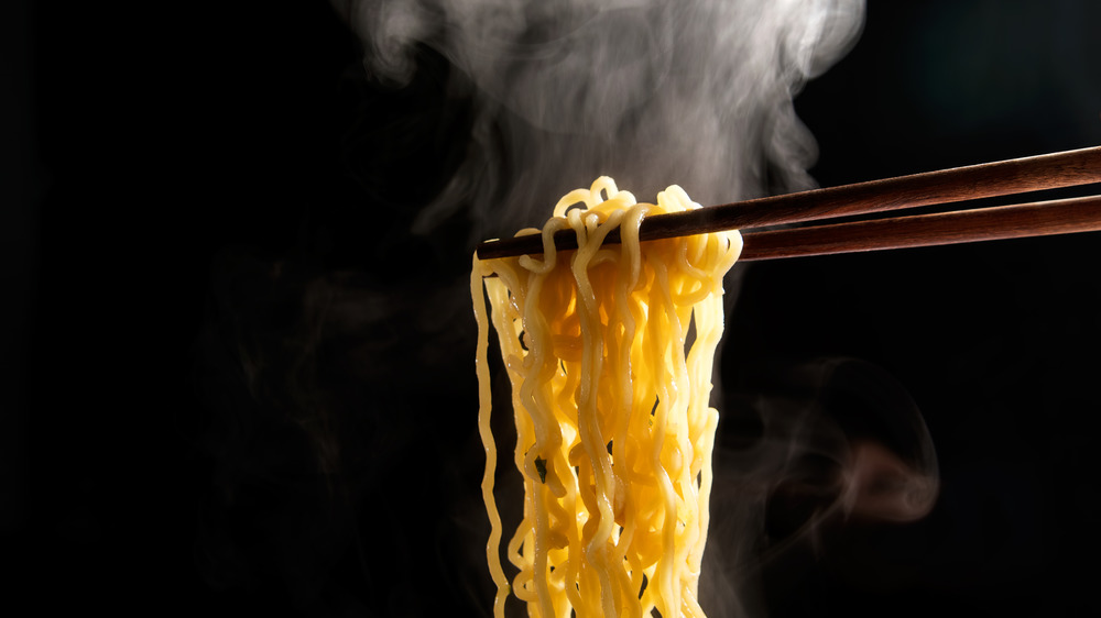Chopsticks lifting noodles