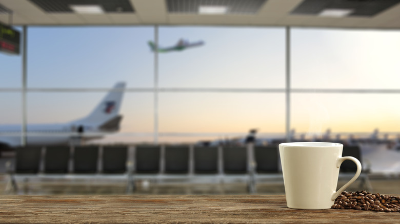 A cup on a table inside an airport