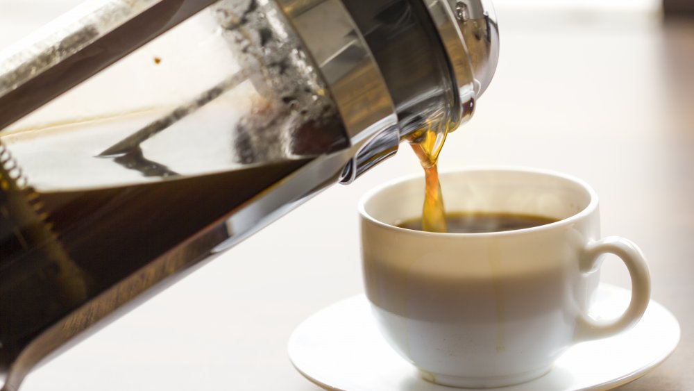 pouring coffee from a French press