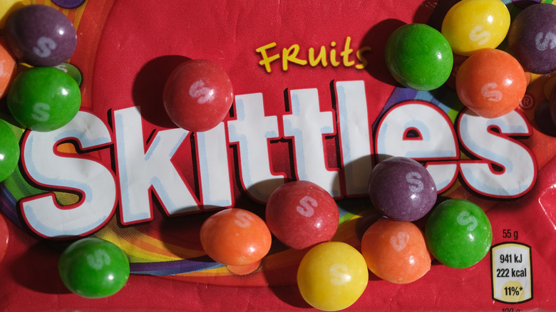 A pack of skittles with candies