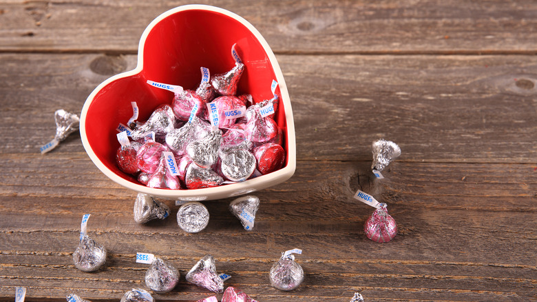 Heart-shaped bowl of Hershey's Kisses