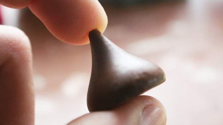 Hershey's Kiss in hand close up