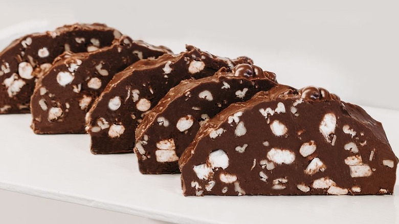 Sliced and displayed rocky road fudge on white background