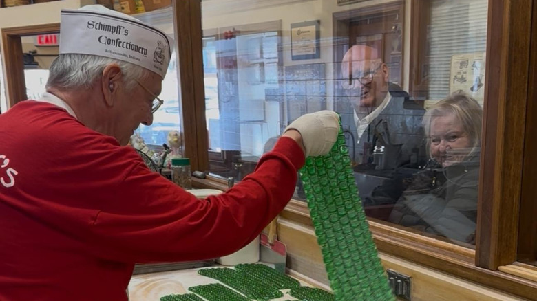 Person making candy in Schimpff's Confectionery