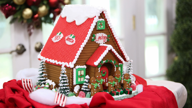 Gingerbread house on red fabric