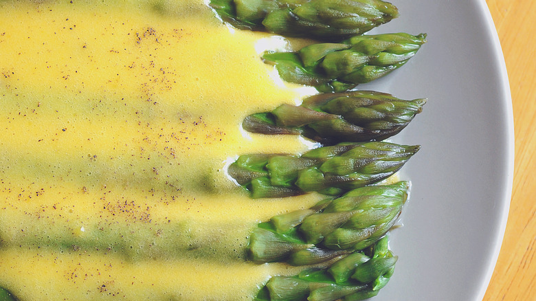 Holandaise sauce over asparagus