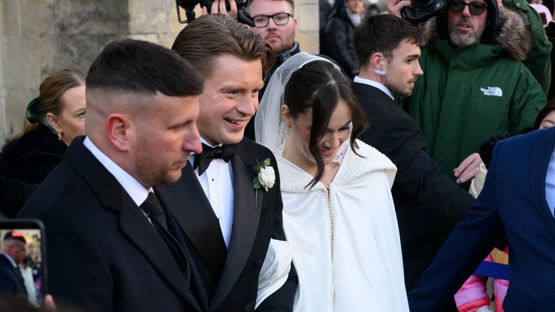 Holly and Adam Peaty in crowd on wedding day