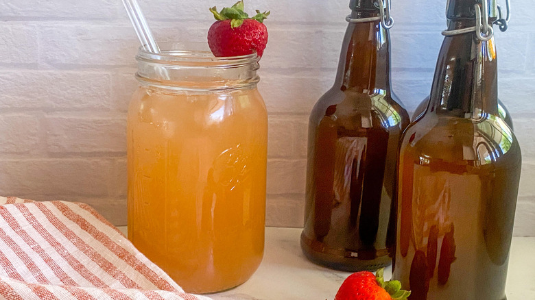 kombucha in glass with strawberries