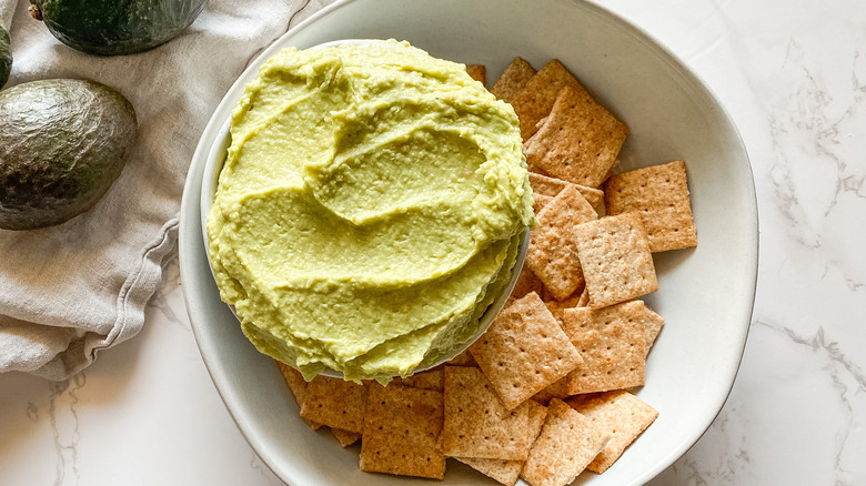 avocado hummus dip with crackers