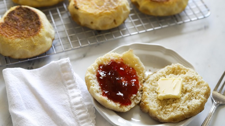 english muffin on plate with jam and butter