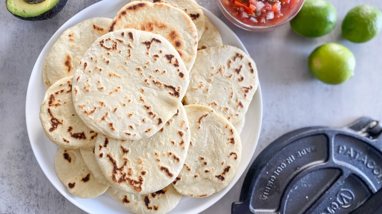 homemade flour tortillas and tortilla press