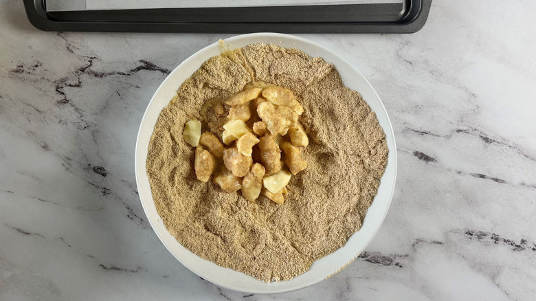 Cheese curds in bowl of breadcrumbs
