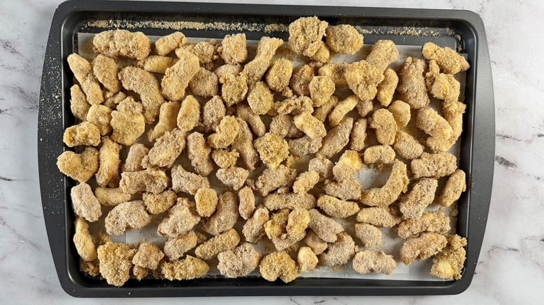 Unfried cheese curds on baking sheet