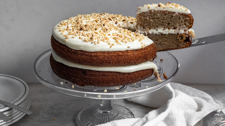 a slice of spice cake being removed from the two-layer dessert