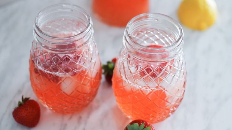 A pair of jars of strawberry lemonade