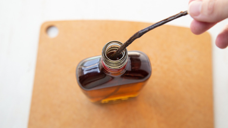 vanilla bean going into brandy
