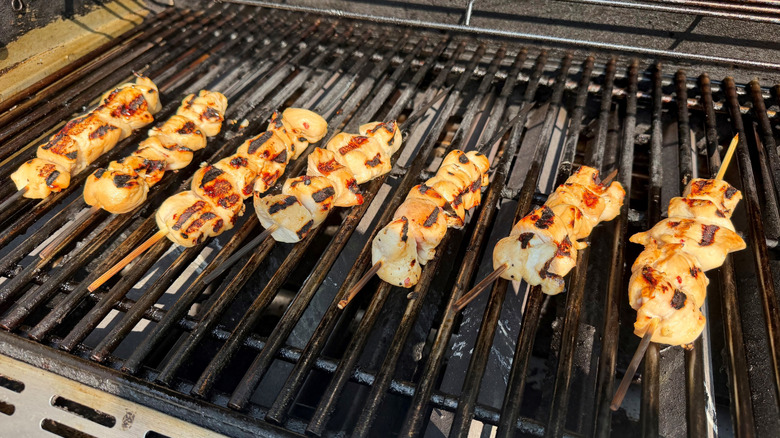 Chicken skewers on grill