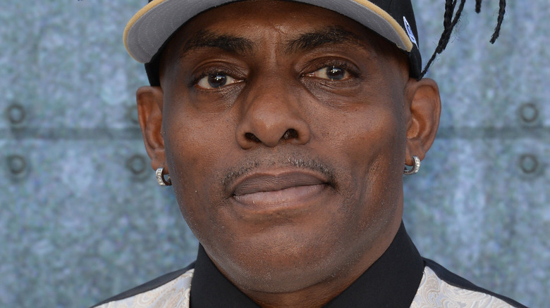 Coolio wearing Saints cap