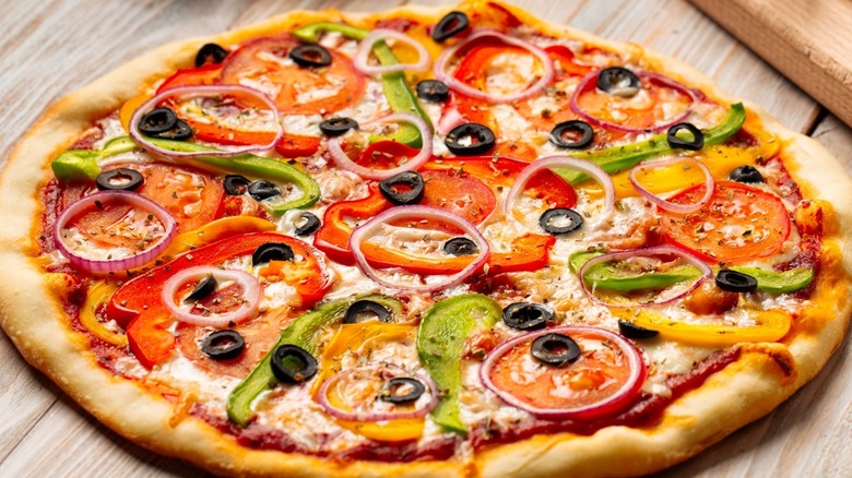 pizza with peppers, onions, olives