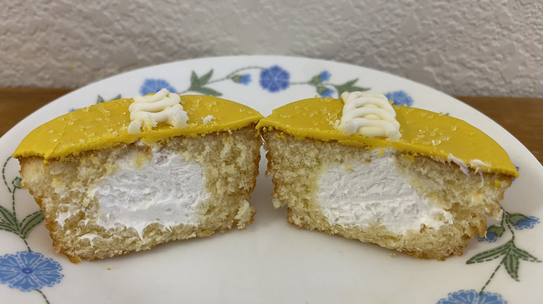Hostess Peeps Cupcake split in half to reveal marshmallow filling on a flower-patterned plate