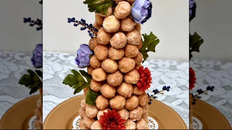 powdered sugar donut holes on a plate