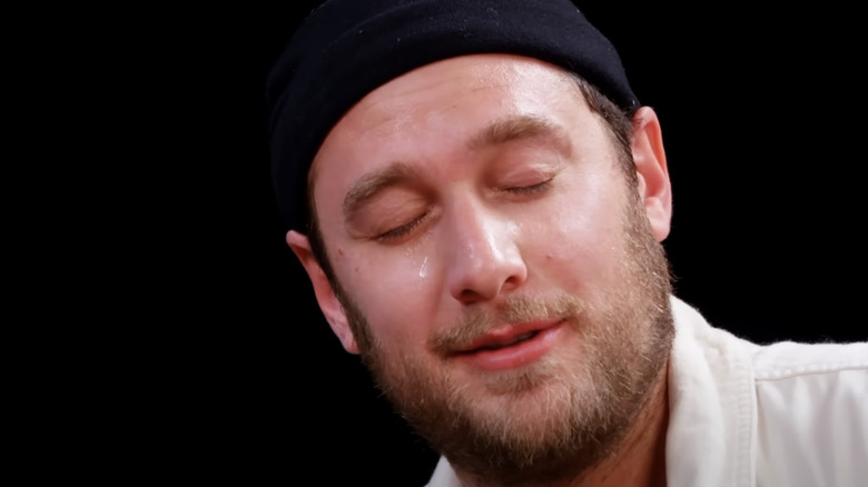 Brad Leone with eyes closed on Hot Ones