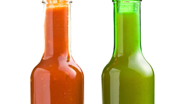 Red and green hot sauce bottles