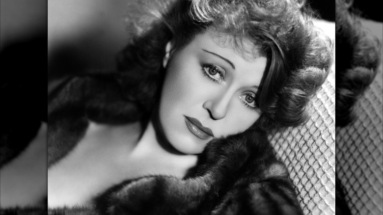 Actress Ruth Chatterton, posing in a fur coat.
