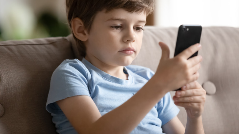 little boy using smartphone